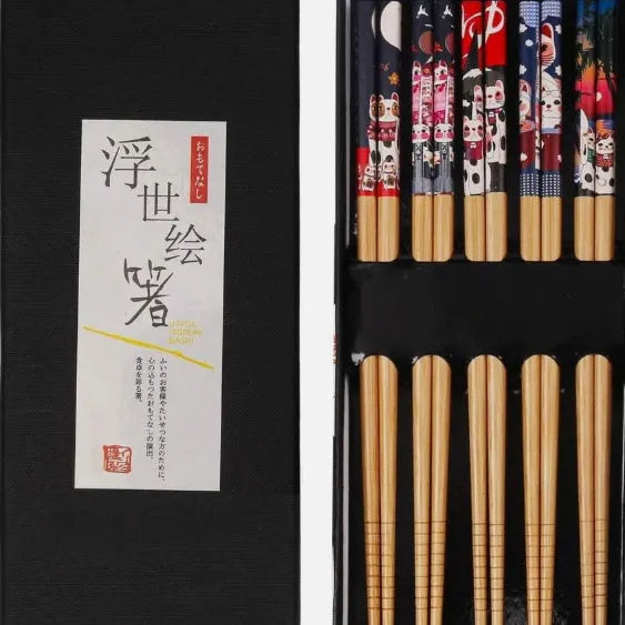 Set of five Japanese style patterned bamboo chopsticks showing lucky cat and pool elegant blue cartoon designs.