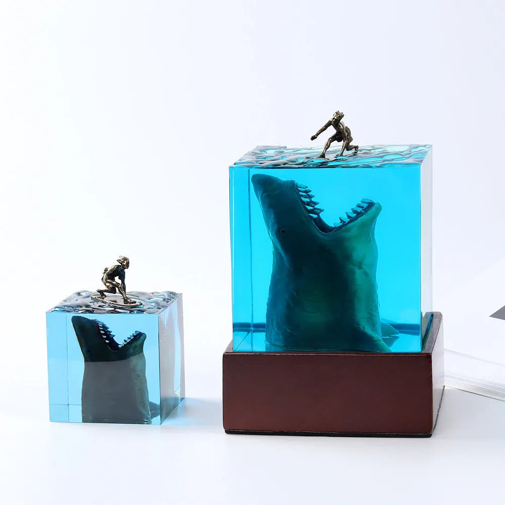 Clear epoxy resin night light ornament with a shark surfer scene inside, shown in 5cm and 8cm sizes.