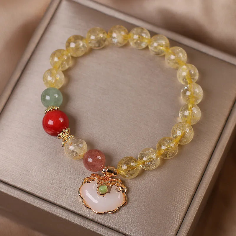 Women's alloy bracelet with a yellow hair crystal jade ruyi pendant charm.