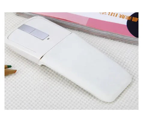 Black folding Bluetooth wireless mouse showing touch scroll area and compact folded size