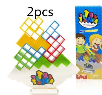 Plastic balance stacking board game with 16 coloured blocks, chassis, and base on a table