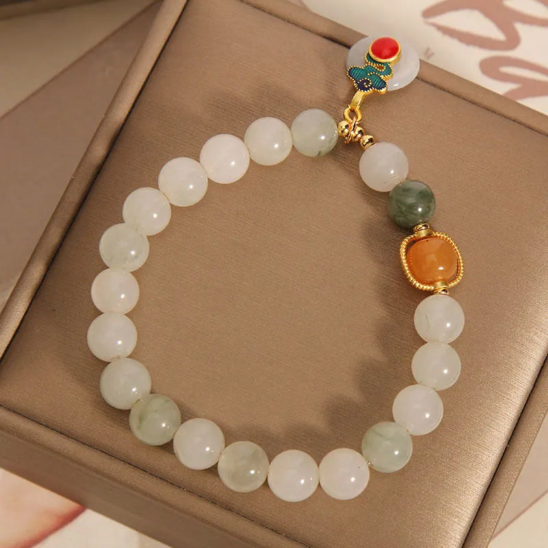 Ice jade bracelet for women with pearl charm and jade buckle in Chinese retro style.