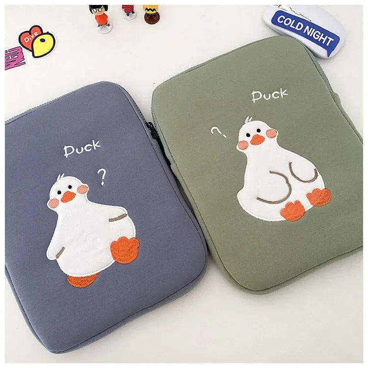 Blue cotton tablet case with cartoon duck embroidery and a zip closure, sized for an 11-inch tablet.