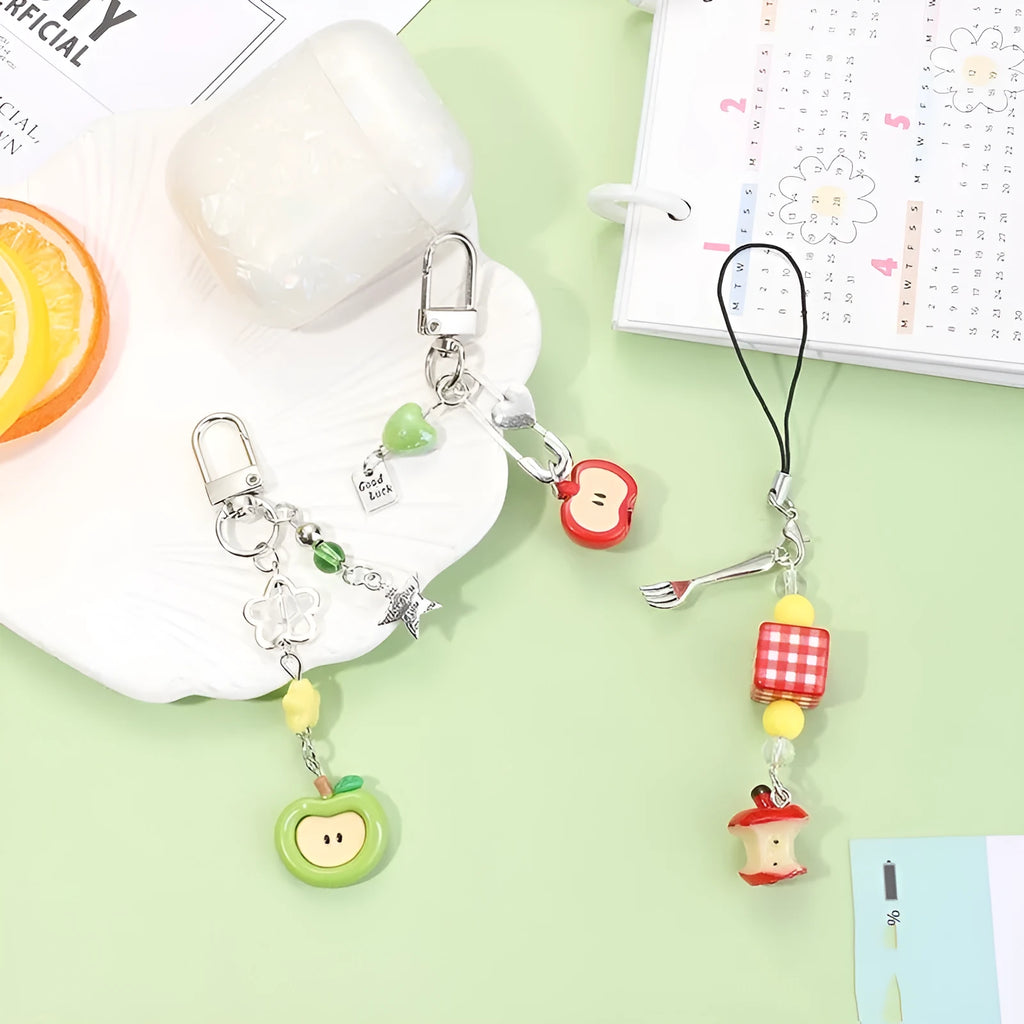 Plastic resin mobile phone charm keychain with fruit designs including apple and strawberry patterns