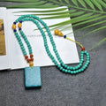 Turquoise mesh flower lucky pendant on ball bead chain necklace, hand-woven construction