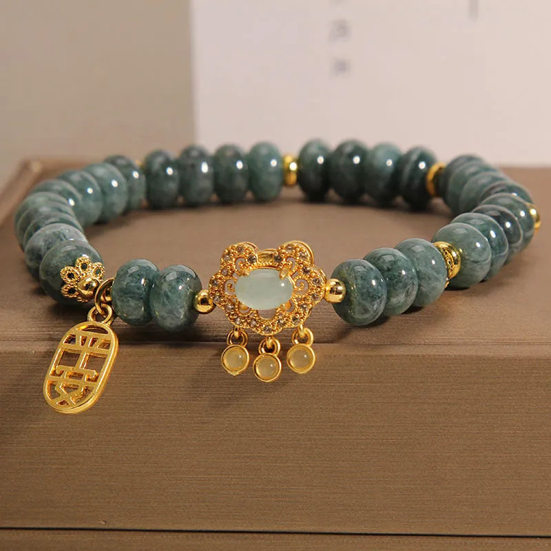 Natural emerald jade abacus bead bracelet for women with a metal safety lock closure.