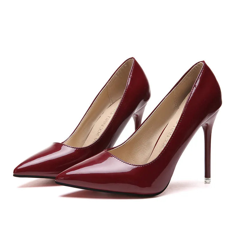 Women's pointed toe stiletto high heel pump in a solid colour with a buckle, shown on a 8cm+ super high heel.