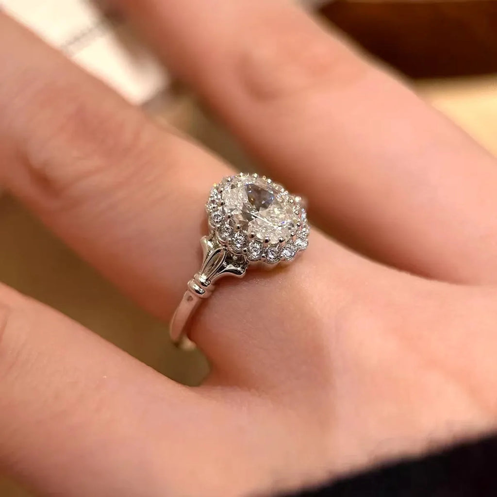 Silver geometric women's ring with large diamond bouquet detail and adjustable opening.