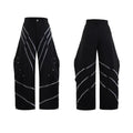 Men's black trousers with structured three-dimensional cut and metal rivet pleats on the legs.
