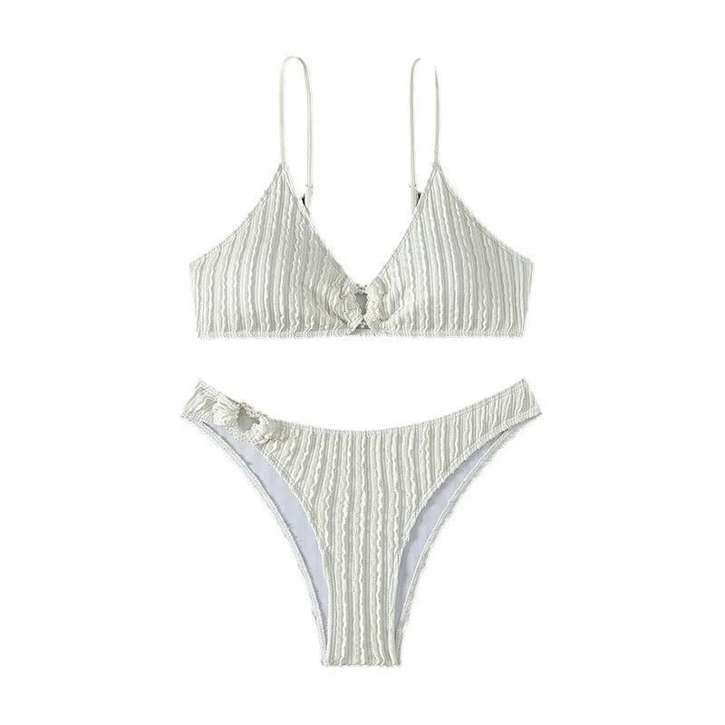 White women's V-neck sleeveless swimsuit top with matching split hem shorts.