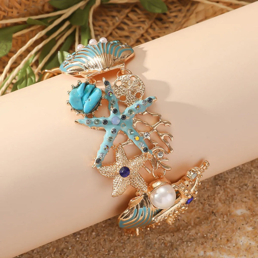 Women's alloy rhinestone bracelet featuring marine anchor and starfish design in coastal colours