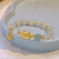 Glass and coloured glaze bracelet with animal zodiac charm and electroplated finish in red, pink, or white pearl.