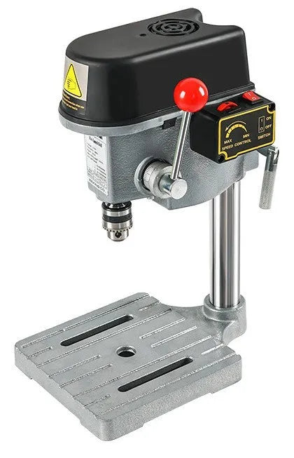Mini bench drill and milling machine on a workbench with cross bench pliers.
