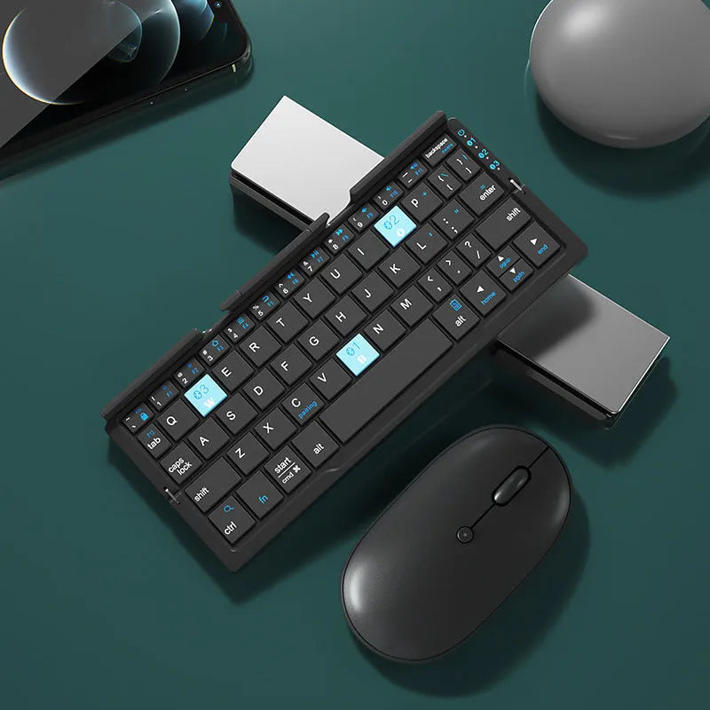 Silver white folding Bluetooth keyboard open with smartphone propped on integrated stand