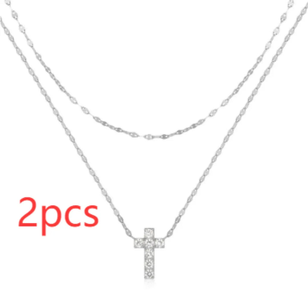 S925 sterling silver double layer twin diamond cross pendant necklace on a clavicle chain.