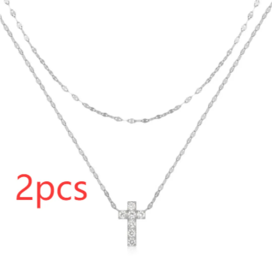 S925 sterling silver double layer twin diamond cross pendant necklace on a clavicle chain.