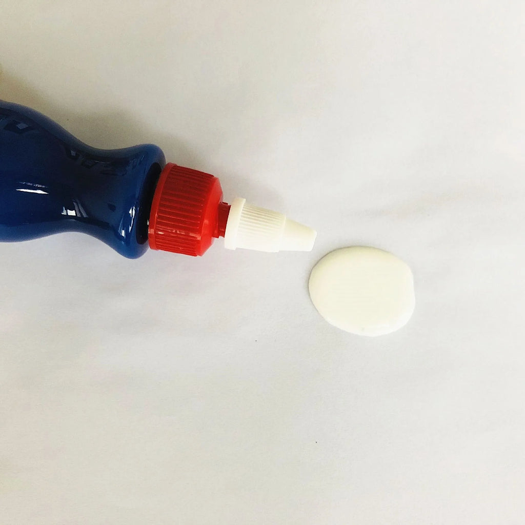 Blue car scratch repair kit with bottle of repair agent and application tool for automotive paint touch-ups
