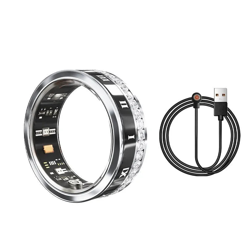 Diamond inlaid smart ring for blood oxygen monitoring in silver and gold colours on a finger.