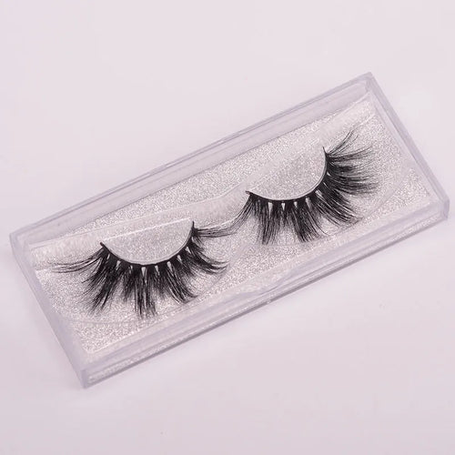 5D mink false eyelashes with protective hair cap and double-headed brush on white background