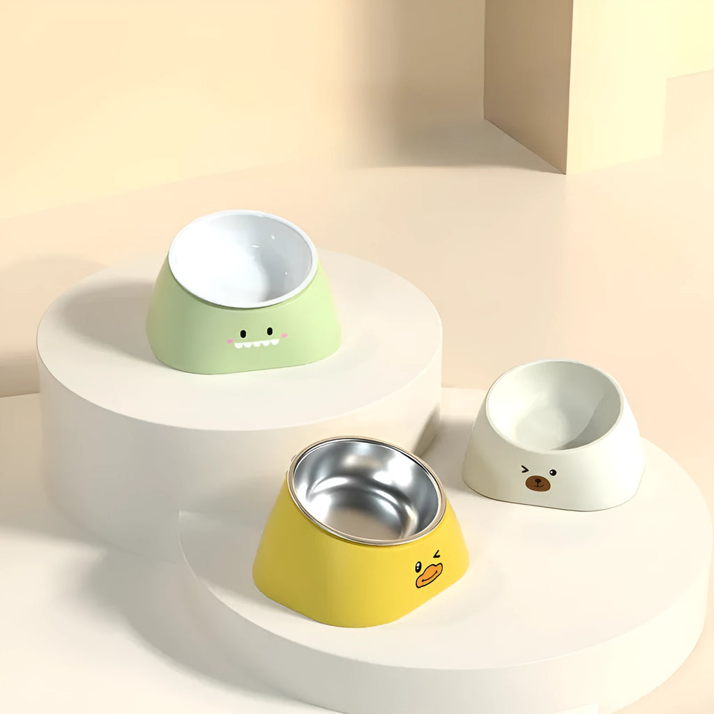 Green 15-degree tilted pet feeding bowl with stainless steel interior and wide PP base for cats and dogs.