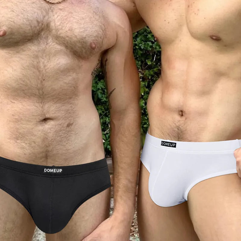 Men's solid colour seamless low-waist briefs on a white background.