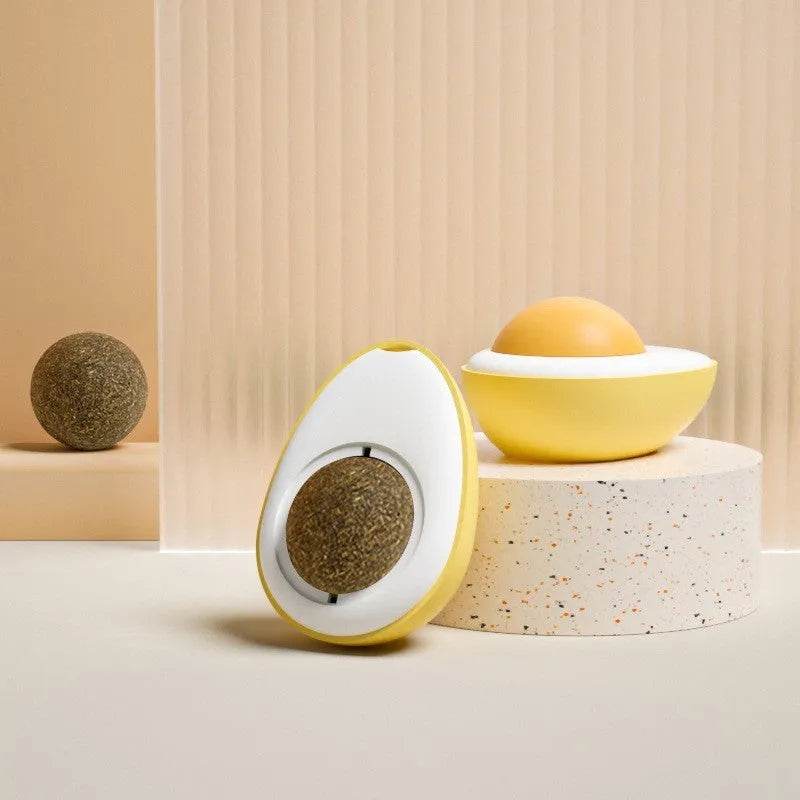Interactive plush catnip ball toy stuck on a wall, showing Fried Egg and Poached Egg shape options.