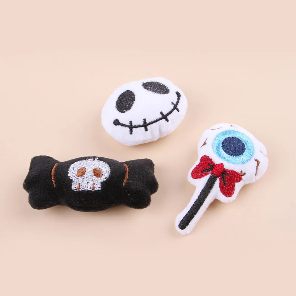 Small cat teaser wand with candy, eyes and skull plush attachments