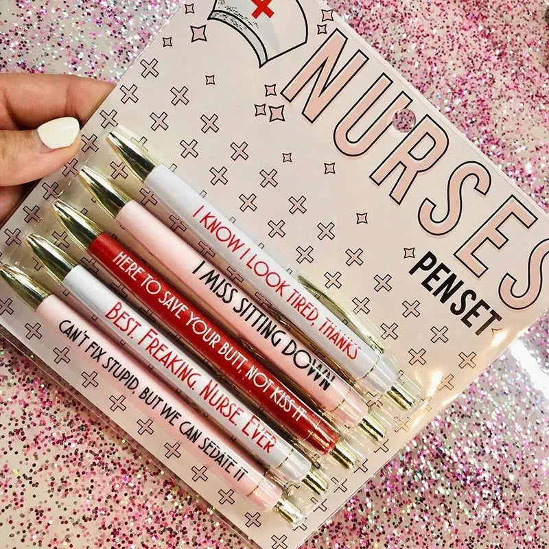 Five nurse-themed retractable ballpoint pens with medical motif designs arranged together