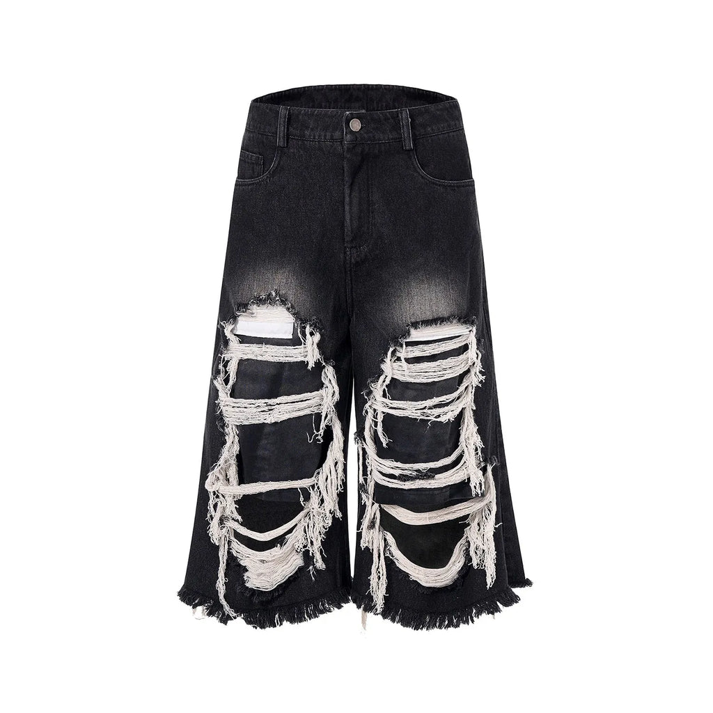 Women's black cropped wide leg jeans with mid-high waist and ripped patch detailing