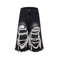 Women's black cropped wide leg jeans with mid-high waist and ripped patch detailing