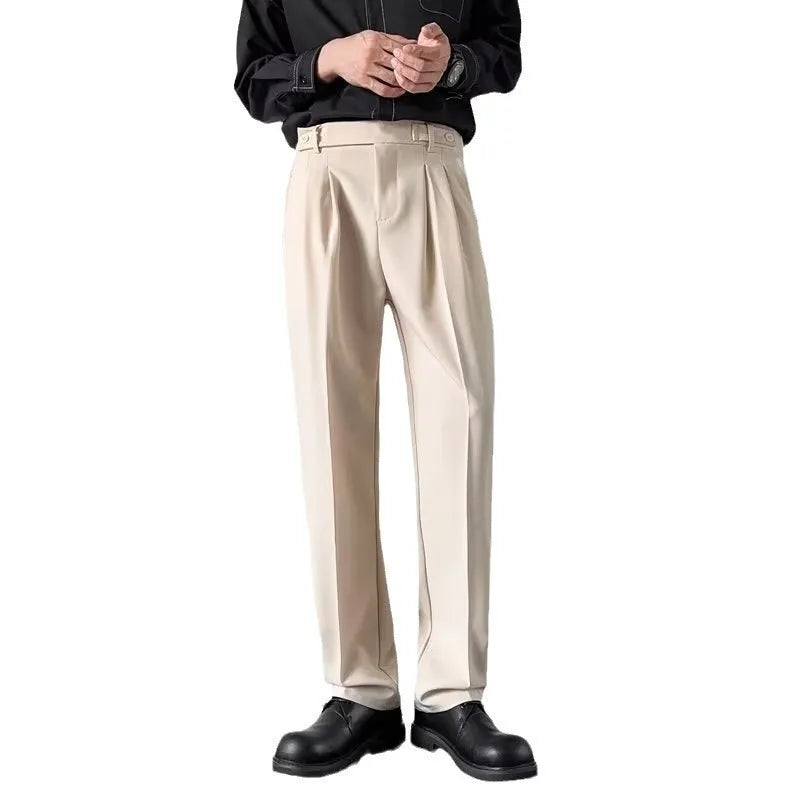 Men's straight-leg loose-fit suit trousers in apricot colour on a hanger.