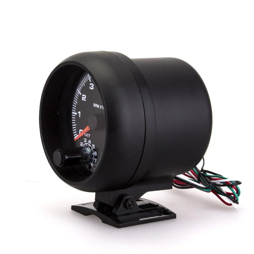 Black automotive tachometer with blue light pointer display and digital readout showing RPM measurement