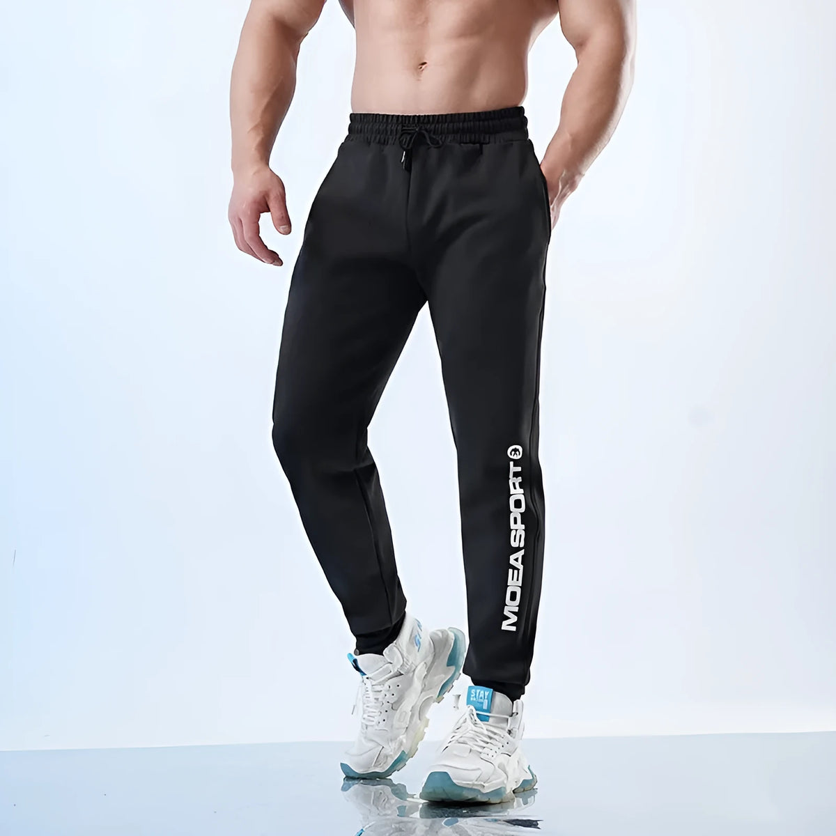 Men's black air layer ankle-tied sweatpants with mid-waist design for casual sports wear