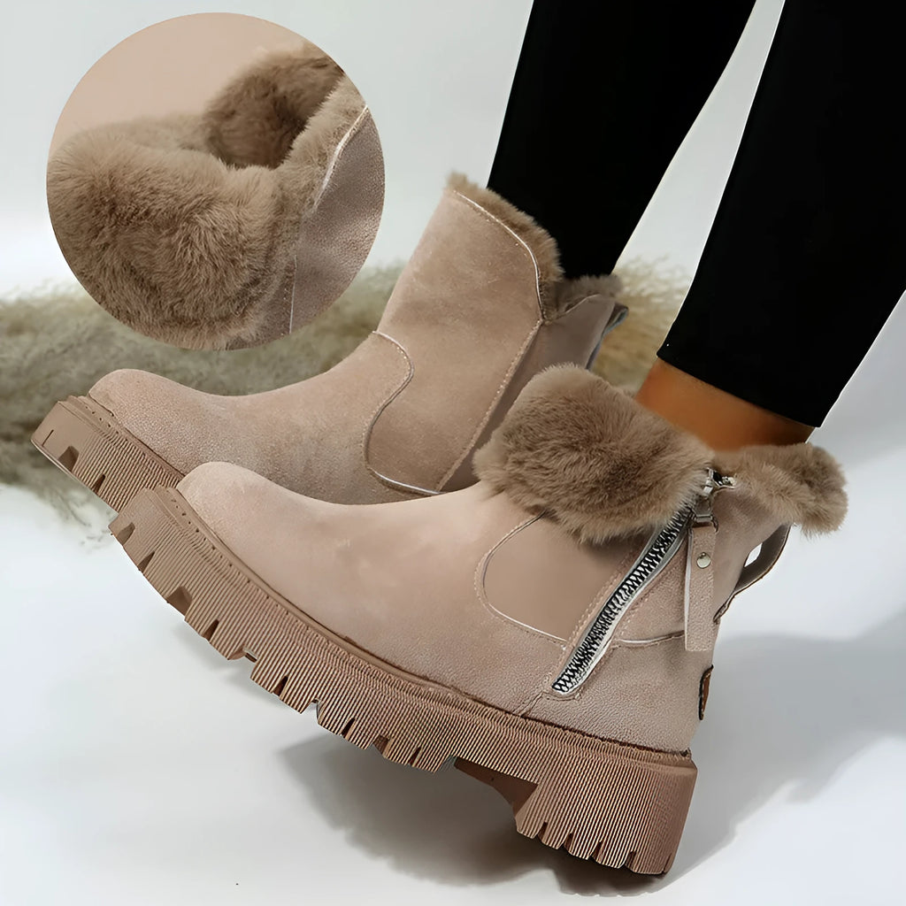 Women's black high-top snow boots with faux suede uppers, side zipper, and fluffy fur lining.