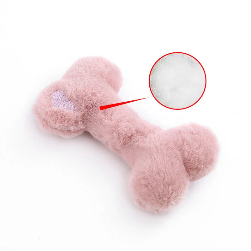 Soft plush dog toy shaped like a bone with a love heart design, in blue colour with a squeaker.