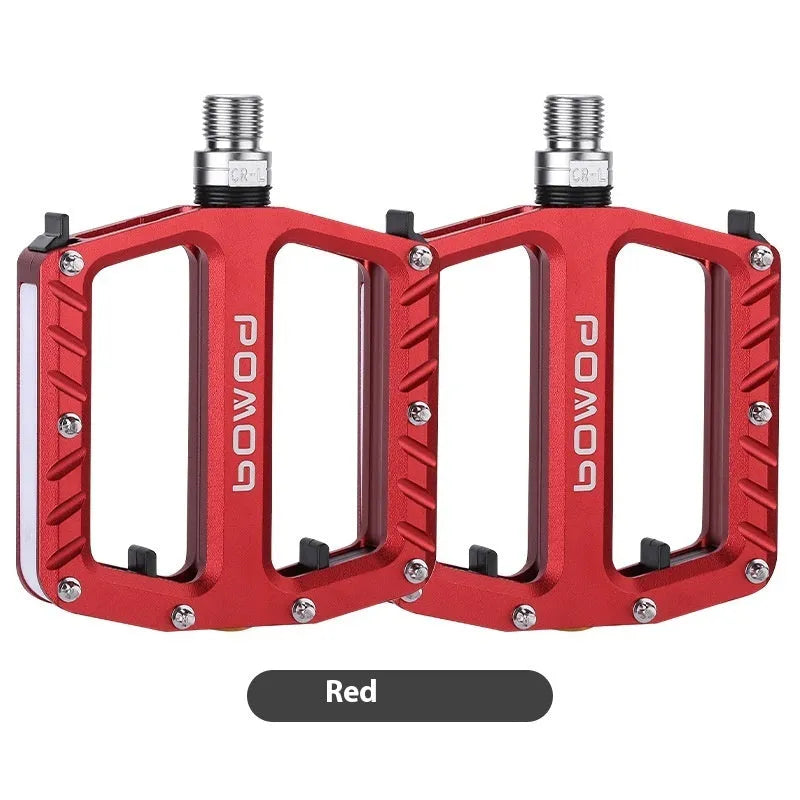Bicycle pedal with integrated LED lights in aluminium alloy construction showing colour options