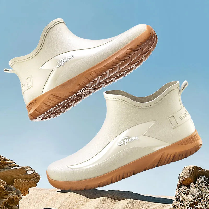 Men's short PVC rubber boots in beige, black, and black & red colours on a flat heel