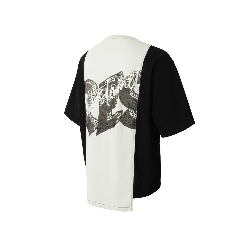 Black and white deconstruction print cotton blend loose T-shirt on a hanger.