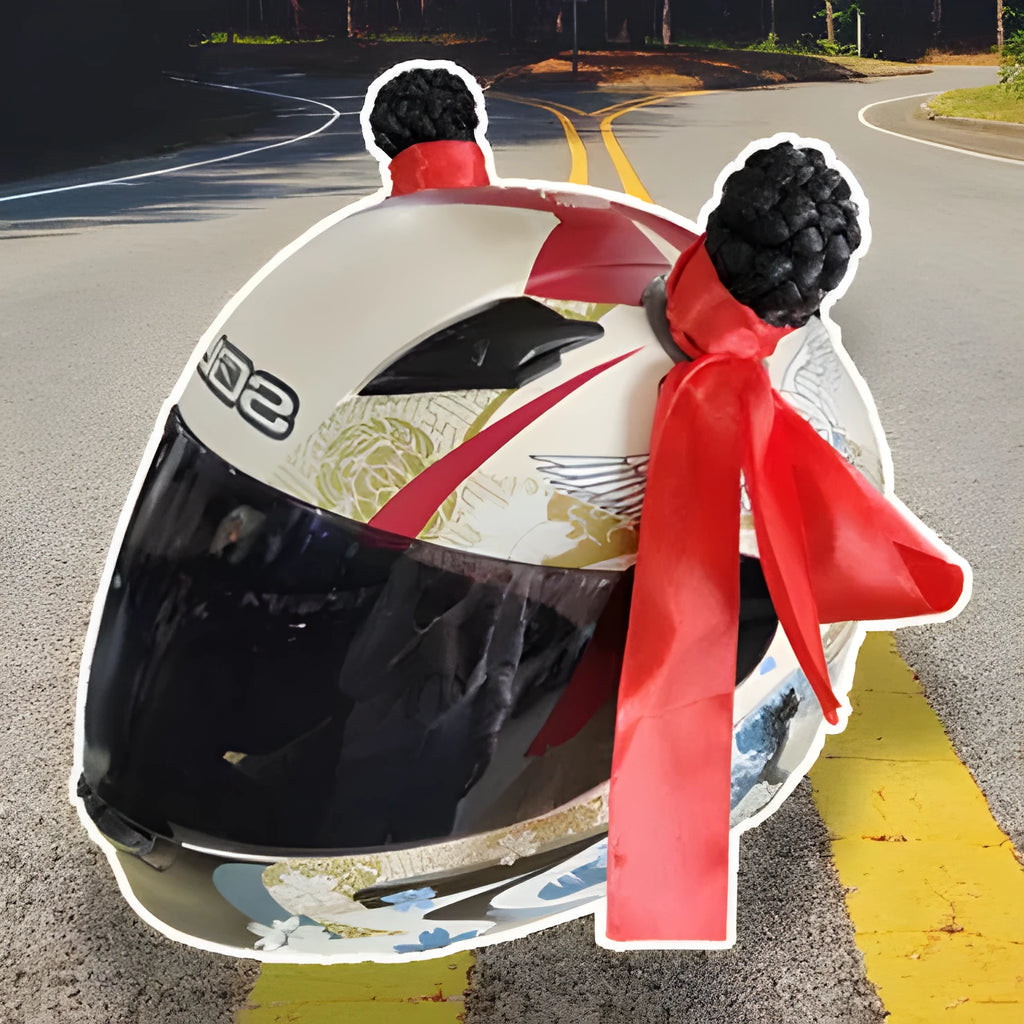 A pair of decorative balls for helmet customisation with non-marking adhesive, shown next to a full-face motorcycle helmet.