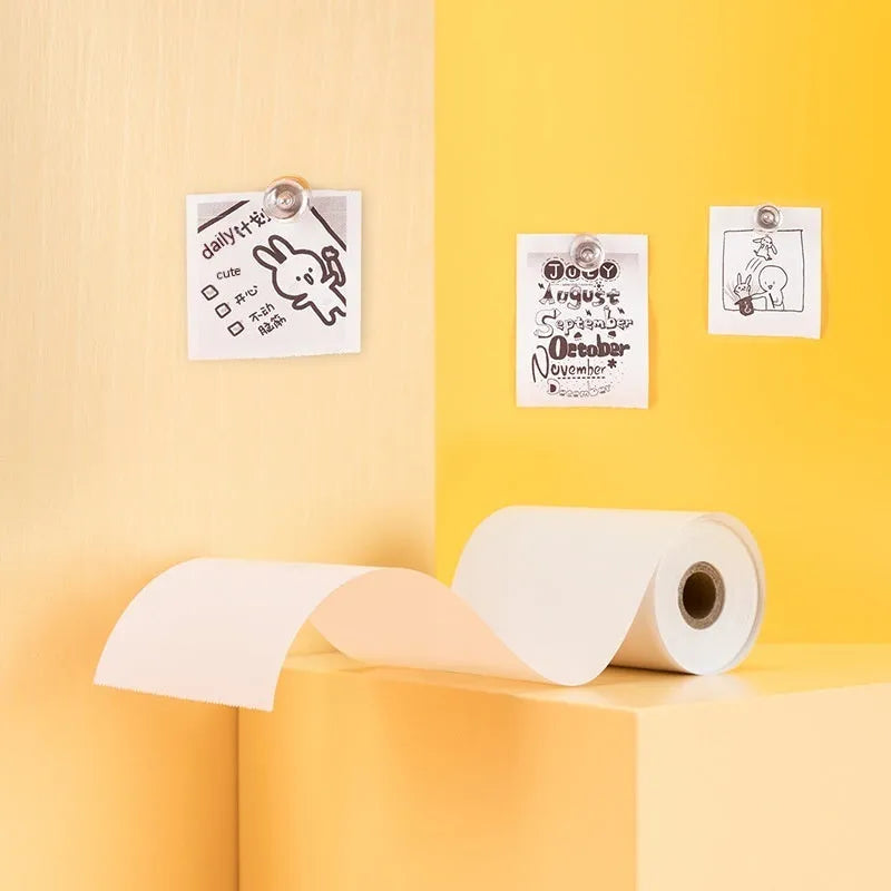 Three rolls of 57mm wide thermal paper in packaging for portable printers