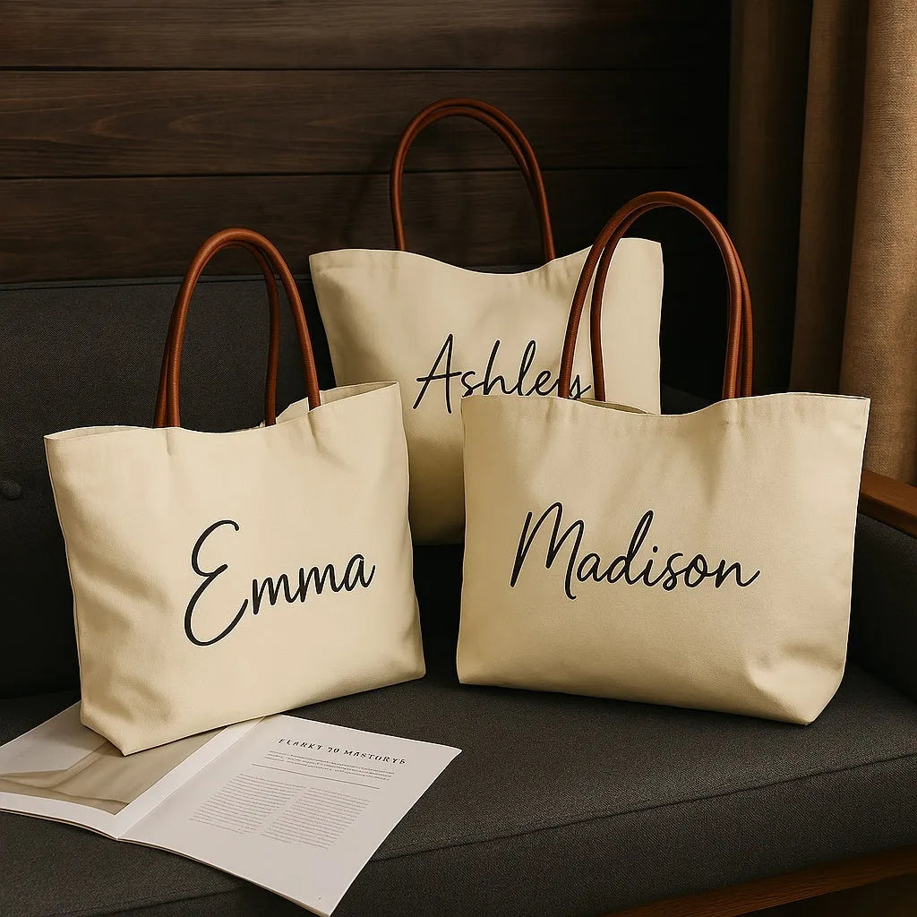 Beige white and white canvas tote bag with long handle straps.