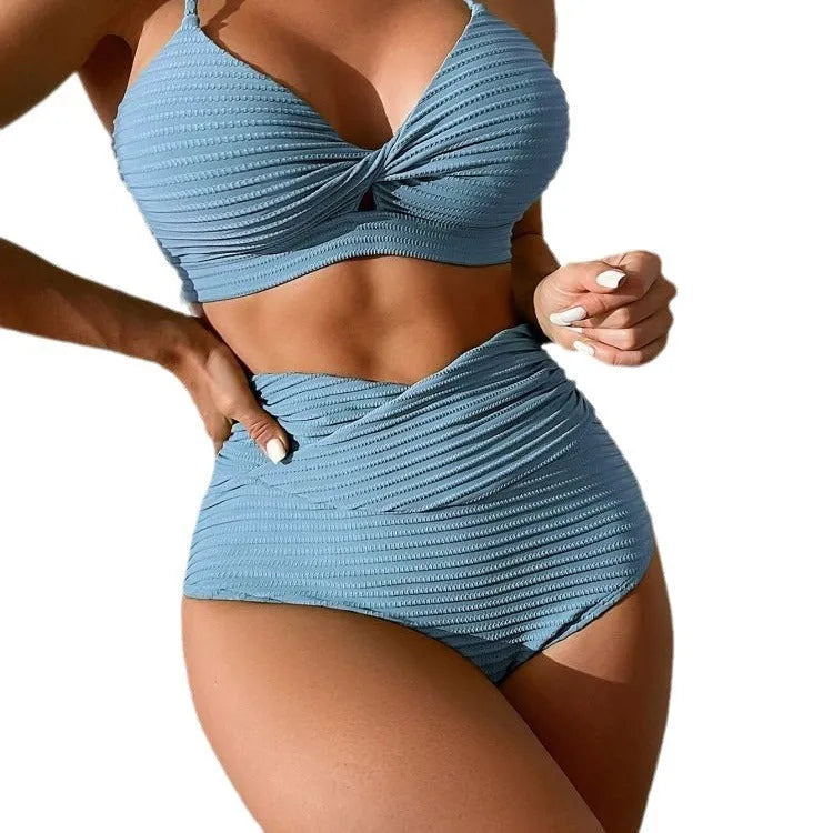 Women's solid colour two-piece bikini swimsuit in navy blue, made from polyester fabric.