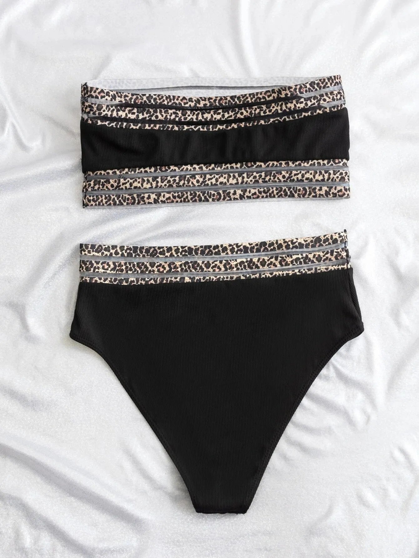 Black strapless bikini set with leopard print design, showing briefs-style shorts and top.