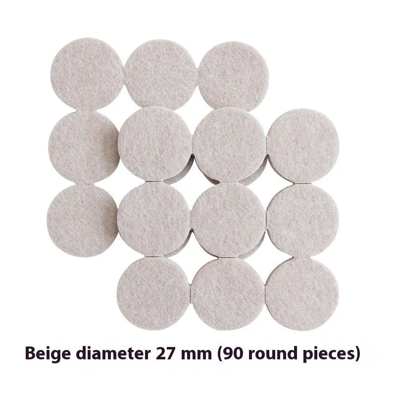 Beige plastic furniture leg stopper pads in five different sizes on a wooden floor
