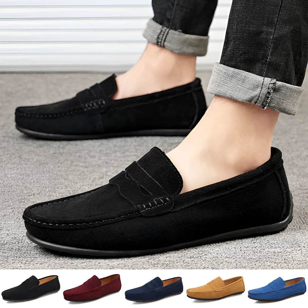 Men's solid colour suede slip-on loafers with a round toe and flat rubber sole.