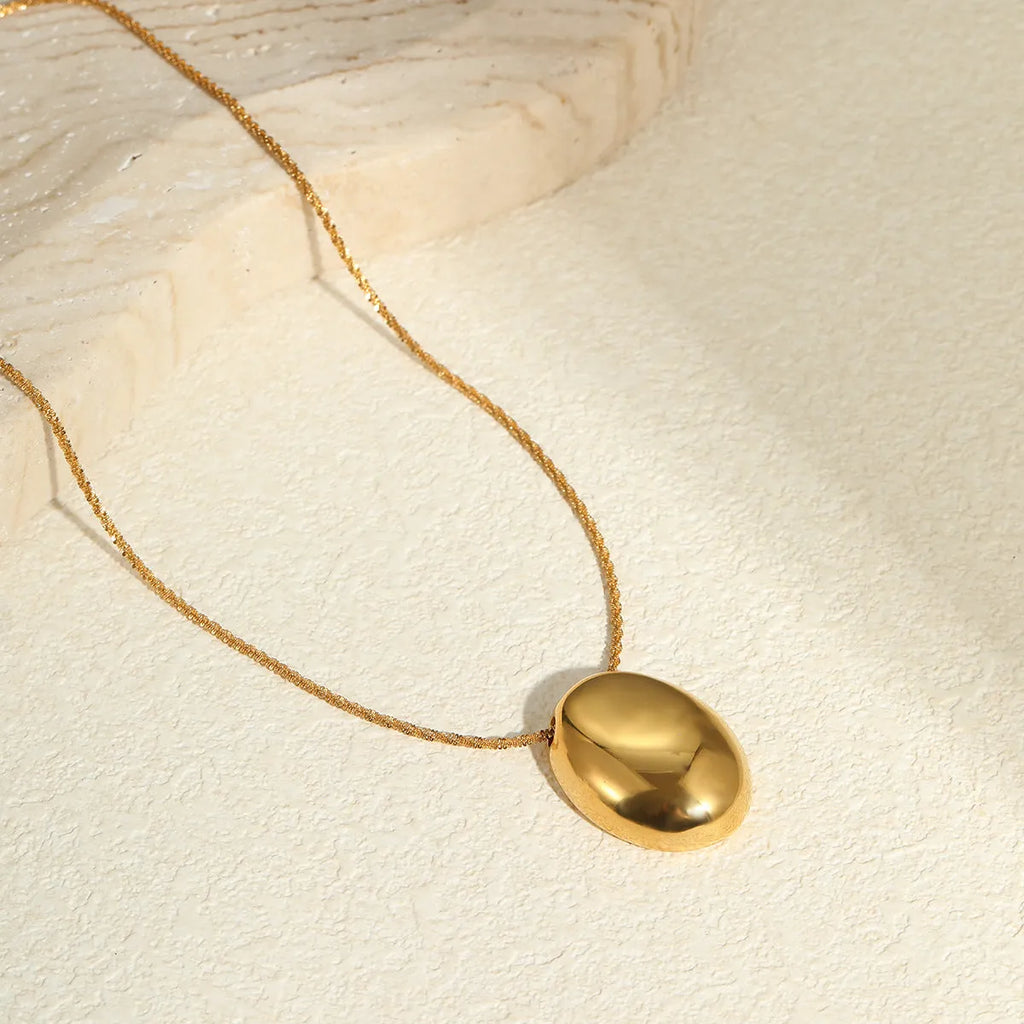 Gold geometric pendant necklace on adjustable 41-50cm chain, stainless steel with electroplated finish