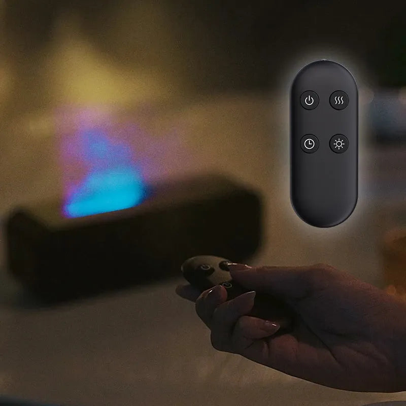 Black aromatherapy diffuser with colour-changing lights and remote control on table
