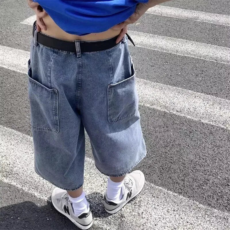 Blue men's cropped high waist denim pirate shorts on a neutral background
