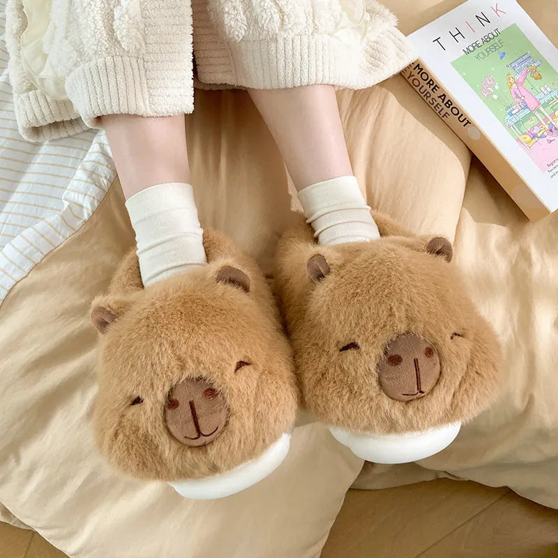 Light brown women's winter plush slippers with a cartoon pattern and artificial wool lining.