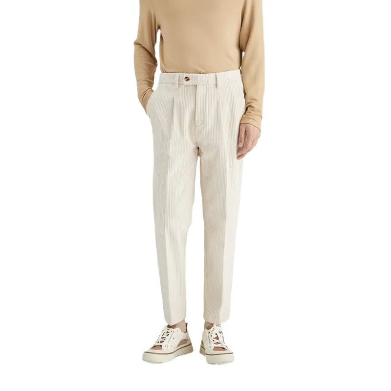 Men's straight-leg loose fit corduroy trousers in beige shown on a model.
